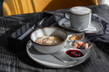 Porridge and coffee. Served breakfast in a cafe.