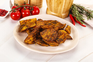 Golden baked potato Idaho with spices