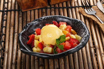 Sweet fruit salad with ice cream