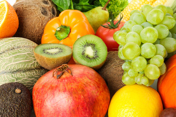 Different fresh fruits and vegetables as background, closeup