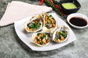 Open half oysters with green onion