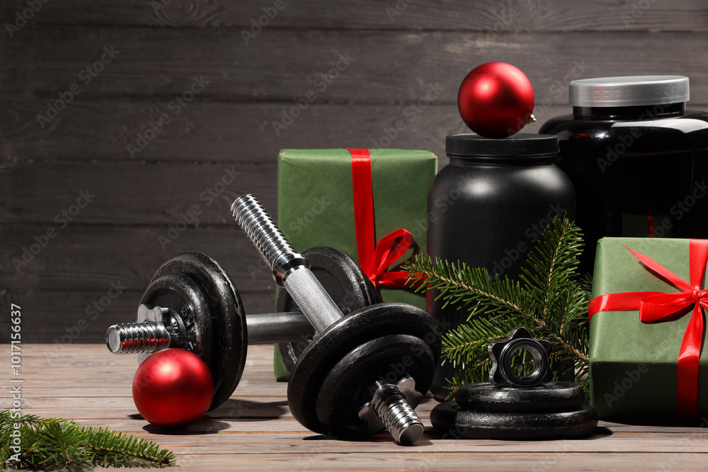 Canvas Prints Dumbbells, containers with supplement and Christmas decor on wooden table