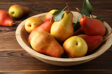 Ripe juicy pears on wooden table, closeup