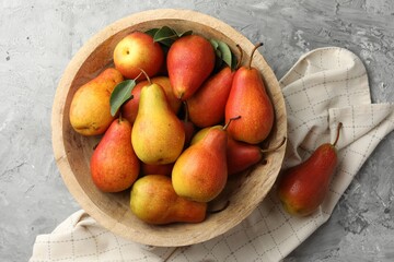 Ripe juicy pears on grey table, top view