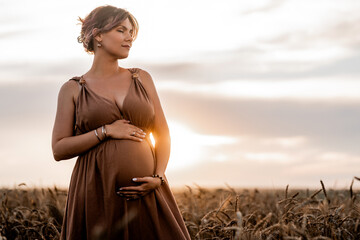 Pregnant Woman Carrying Child, Belly On Wheat Field Background. Expectant Time