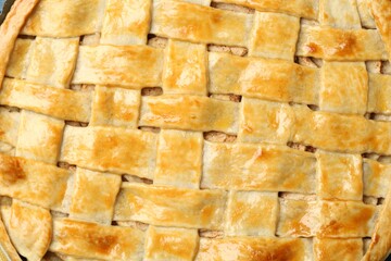 Tasty homemade pie as background, top view