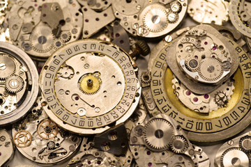Old mechanical watches with gears and cogs. Watch or clock mechanisms