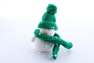 Cute decorative snowman in hat isolated on white