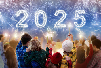 Happy new year. Family watching fireworks.