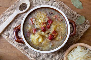 Kapuśniak - homemade, traditional Polish soup made of sauerkraut with potatoes, bacon and sausage