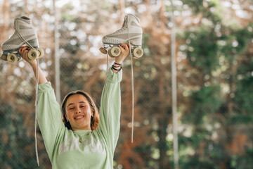 figure skating athlete with skates smiling outdoors