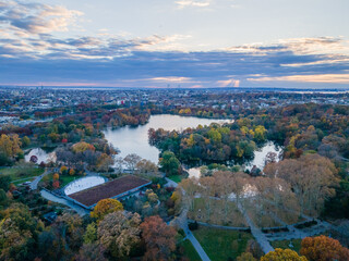 Aerial sunset landscape of Prospect Park in fall with Brooklyn Manhattan skyline New York City