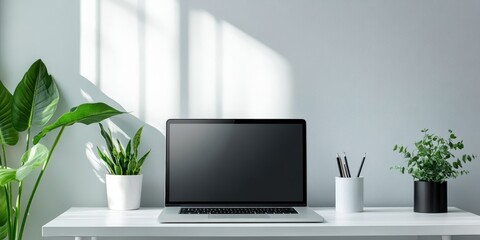 Fototapeta premium Modern workspace featuring a laptop, plants, and a stylish desk with natural lighting.