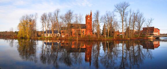 Red brick church at sunrise on the Racquette River, Potsdam, NY