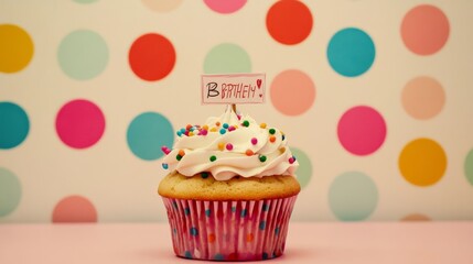 Cupcake with birthday sign on polka dots.
