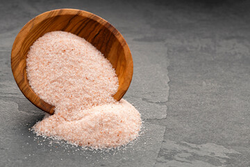 Fine pink Himalayan salt in the bowl - Exotic ingredient for cooking