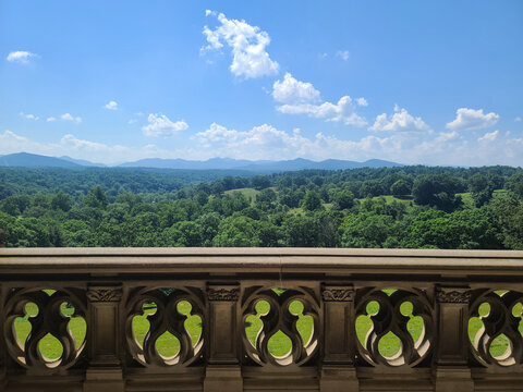 Scenic Balcony View of Green Hills and Mountains