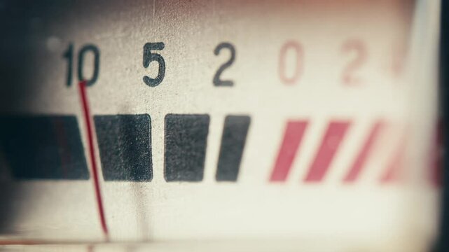 Retro sound level meter decibel meter in studio, vintage audio equipment, close up magnetic tape music player amplifier.