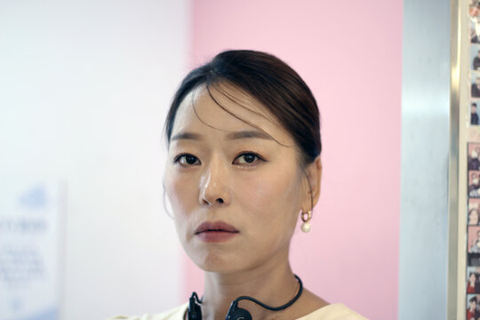 30s business woman posing as a business woman in studio