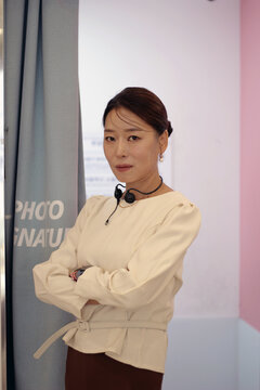 30s business woman posing as a business woman in studio
