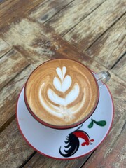 cup of coffee on wood table