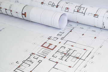 Rolled architectural and construction plans. Residential building designs