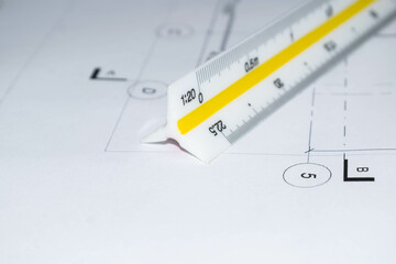 Scalimeter and scale measurement of architectural and construction detail plans with dimensions, axes and grids