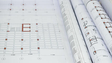 Rolled up technical and construction drawings. Structural framing slab design