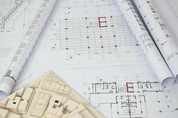 Collection of architectural and construction plans. Rolled structural plans with scale architectural model.