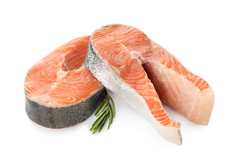 Two fresh salmon steaks and rosemary isolated on white