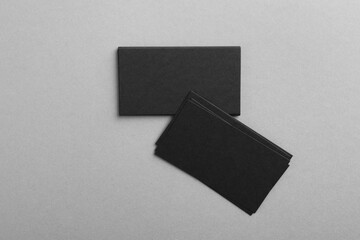 Blank business cards on grey background, top view. Mockup for design