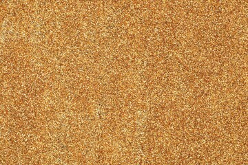 Beautiful shiny golden glitter as background, top view