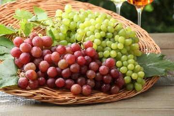 Delicious fresh ripe grapes on wooden table