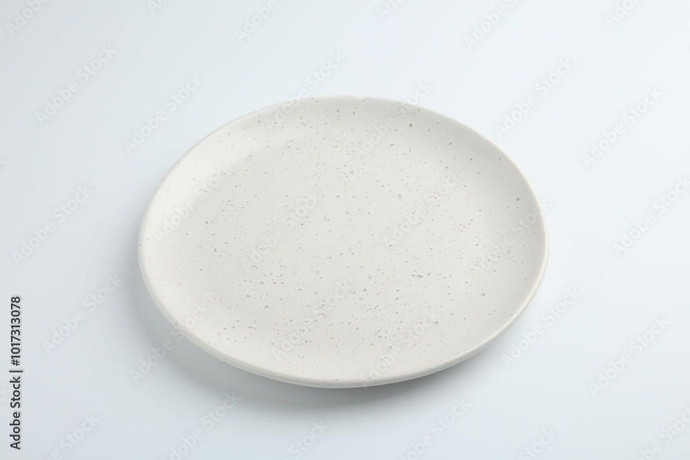 Poster One empty ceramic plate isolated on white