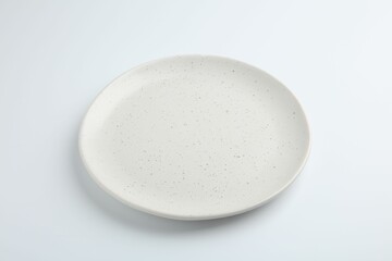 One empty ceramic plate isolated on white