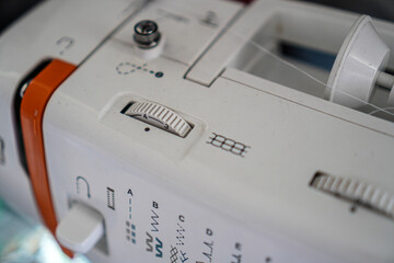 A close-up shot of a sewing machine's stitch selection knob. Close-up of a Sewing Machine Knob dial selection variation.