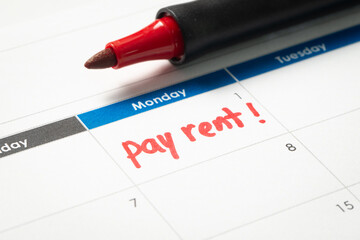 Pay rent reminder written on calendar