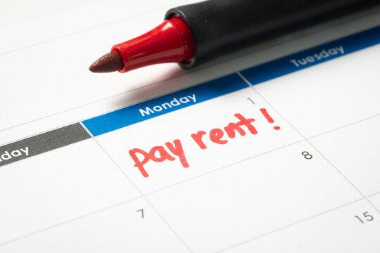 Pay rent reminder written on calendar