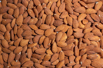 Scattered Almonds. Background from Almond Nuts. Natural High-Calorie Snacks