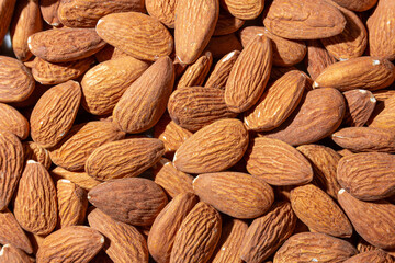 Scattered Almonds. Background from Almond Nuts. Natural High-Calorie Snacks