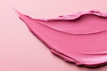 A macro shot of a creamy moisturizer smear in soft pastel colors isolated on a solid pink background, ideal for beauty product packaging ads and cosmetics.