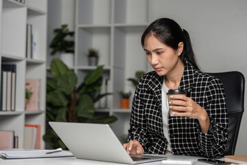 Business Woman Working from Exhaustion and Stress in Modern Office Environment with Laptop and Coffee
