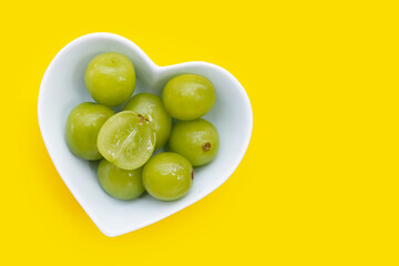 Shine muscat grape on yellow background.