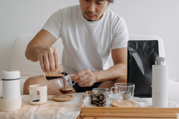 Step by step of Asian man making espresso with hand press tools.