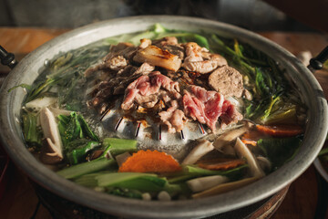 Close-up of Moo Kra Ta or Thai BBQ buffet, famous all you can eat grilled food.