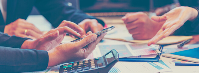 Fototapeta premium Banner Group of business people meeting in conference room. Panorama Asian businesspeople brainstorm teamwork partnership. Happy teams meeting graph chart business data meeting room with copy space