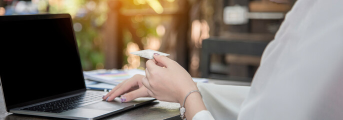 Banner Close up businesswoman hand typing laptop drink black coffee cup. Banner Woman Hands love drinking hot coffee working from home. Business women black coffee hot chocolate cafe with copy space