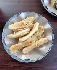 Traditional fried bananas served on a plate.