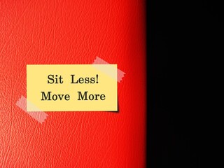Leather red sofa chair seat with handwritten stick note SIT LESS MOVE MORE, concept of having...
