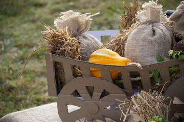 Rustic harvest display with gourds and burlap sacks